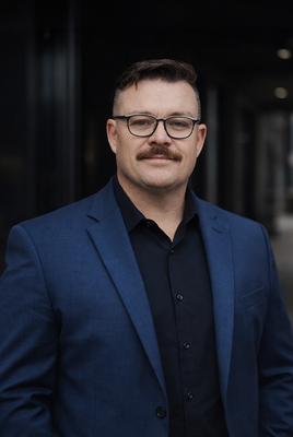 Portrait of Carson Wyndham, Associate.
